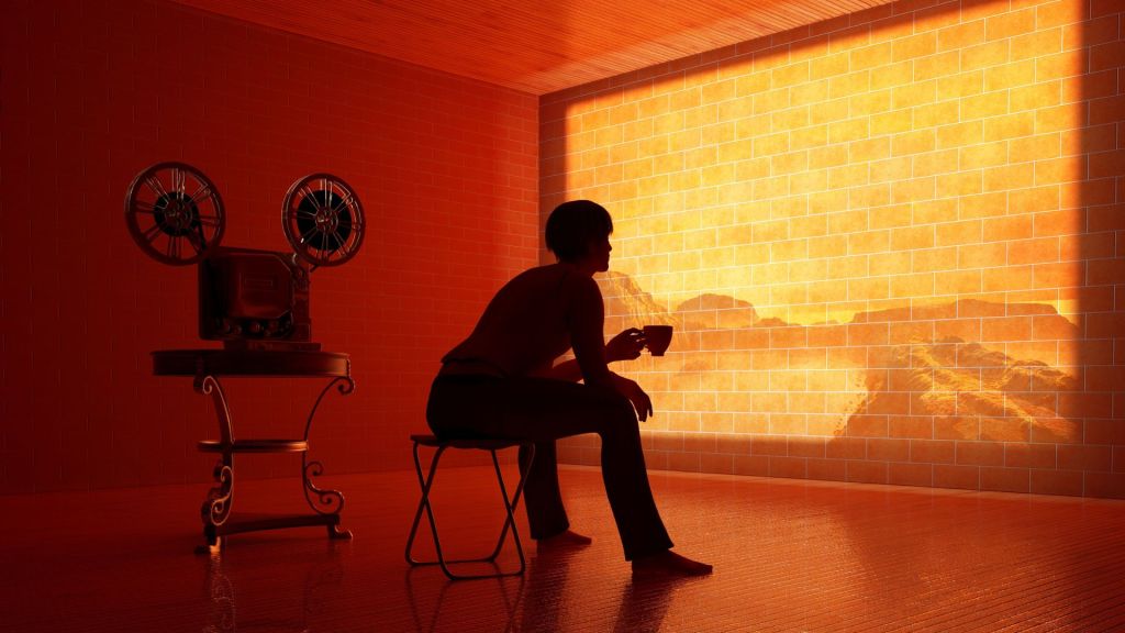 Persona che guarda un film proiettato su un muro, simbolo del fatto che ognuno vive nel proprio film interiore
